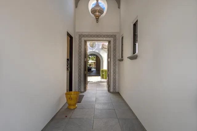 a view of a swimming pool and lounge chairs