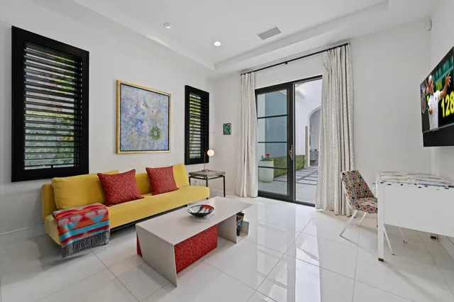 a view of a chairs and table in patio with a lake view