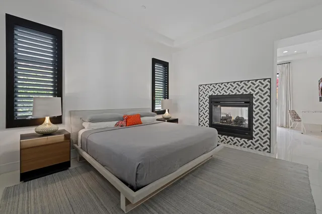 a front view of a house with a yard table and chairs