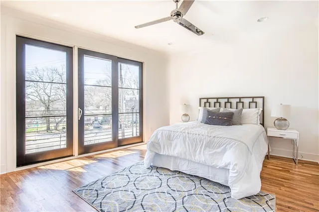 a bedroom with a large bed and a window