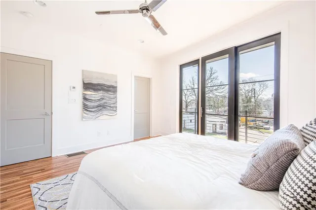 a bathroom with double vanity sinks a shower and a mirror