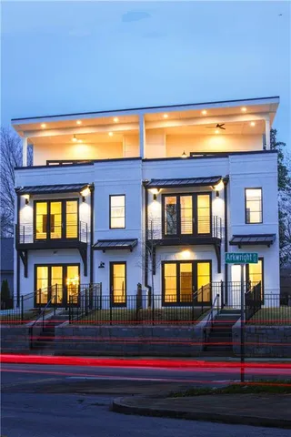 a front view of residential houses with yard
