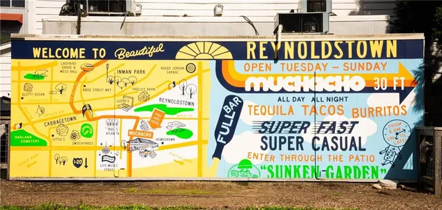 a backyard of a house with barbeque oven table and chairs