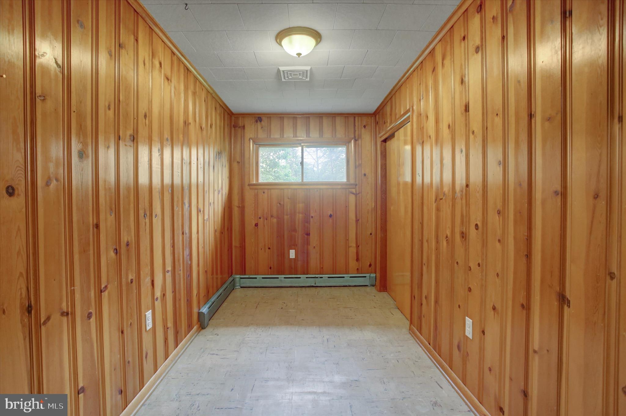 5156 Peach Orchard Road McConnellsburg, PA 17233 - Photo 18 of 34 a view of a hallway with wooden doors