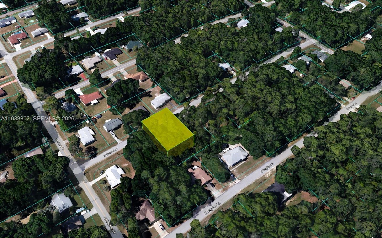 6691 East Harold Lane Inverness, FL 34452 - Photo 3 of 4 an aerial view of a house with a yard and lake view