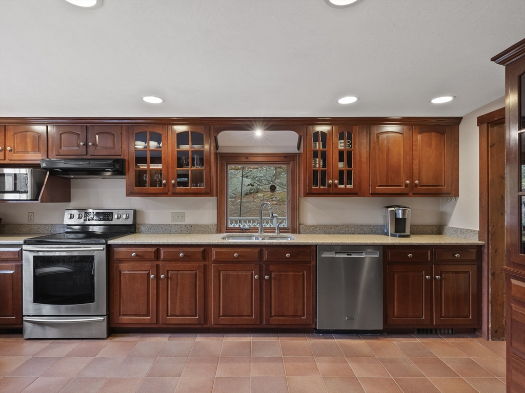 38 Mohawk Drive Acton, MA 01720 - Photo 11 of 35 a kitchen with a sink and cabinets
