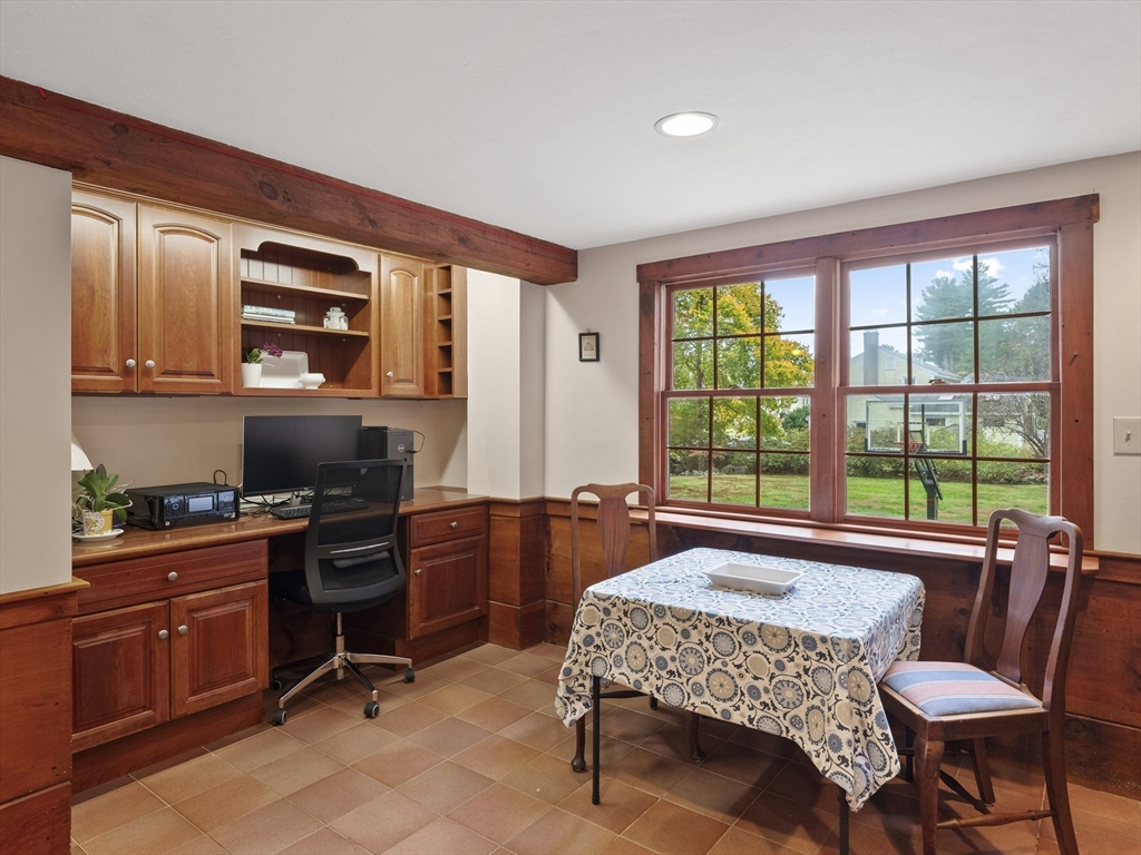 38 Mohawk Drive Acton, MA 01720 - Photo 13 of 35 a kitchen with a stove a sink and chairs