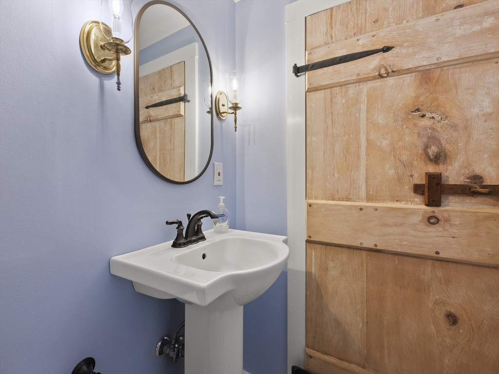 38 Mohawk Drive Acton, MA 01720 - Photo 15 of 35 a bathroom with a sink and a mirror