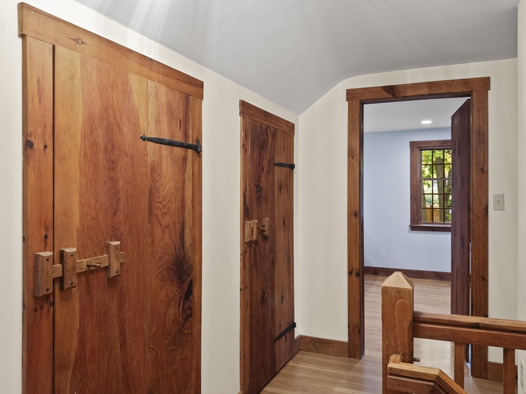 38 Mohawk Drive Acton, MA 01720 - Photo 19 of 35 a view of a hallway with windows and closet area