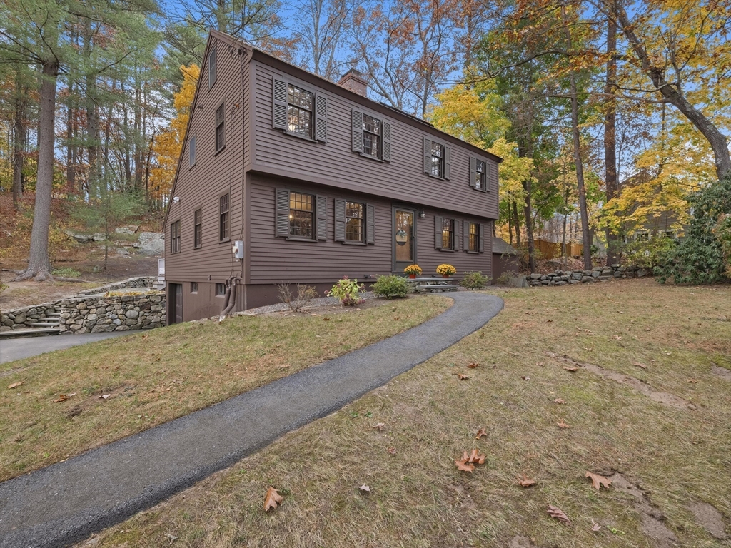 38 Mohawk Drive Acton, MA 01720 - Photo 2 of 35 a view of a house with a yard covered in snow