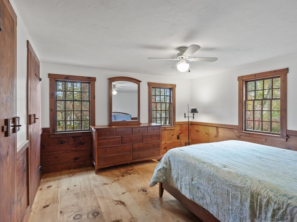 38 Mohawk Drive Acton, MA 01720 - Photo 21 of 35 a bed room with a bed and a dresser