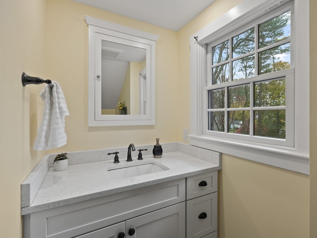 38 Mohawk Drive Acton, MA 01720 - Photo 23 of 35 a bathroom with a sink and a mirror