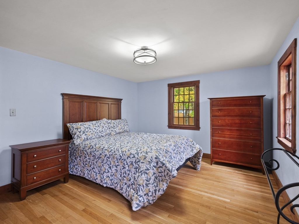 38 Mohawk Drive Acton, MA 01720 - Photo 27 of 35 a bedroom with a bed and a dresser