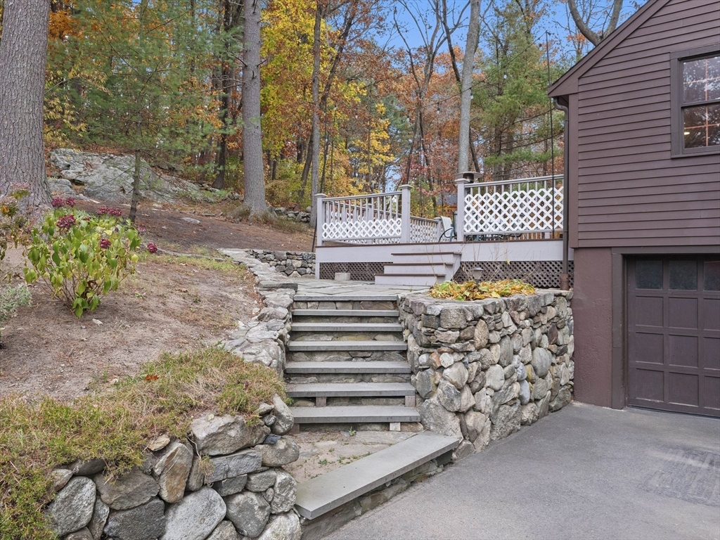 38 Mohawk Drive Acton, MA 01720 - Photo 31 of 35 a front view of a house with a garden