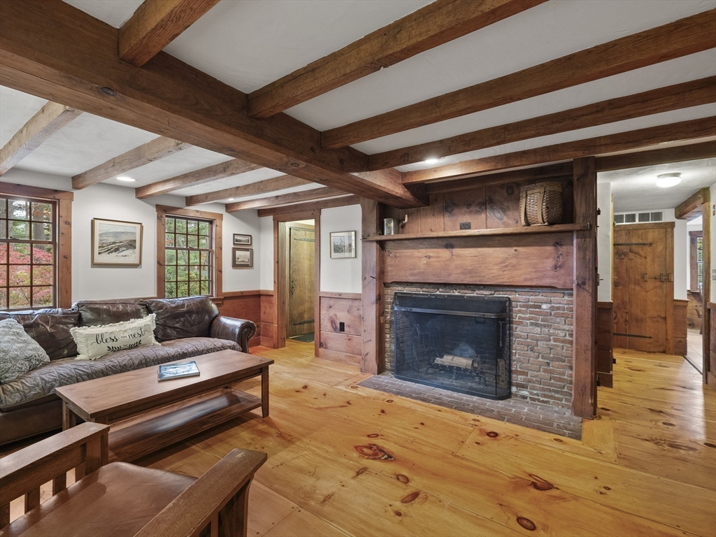 38 Mohawk Drive Acton, MA 01720 - Photo 5 of 35 a living room with furniture and a fireplace