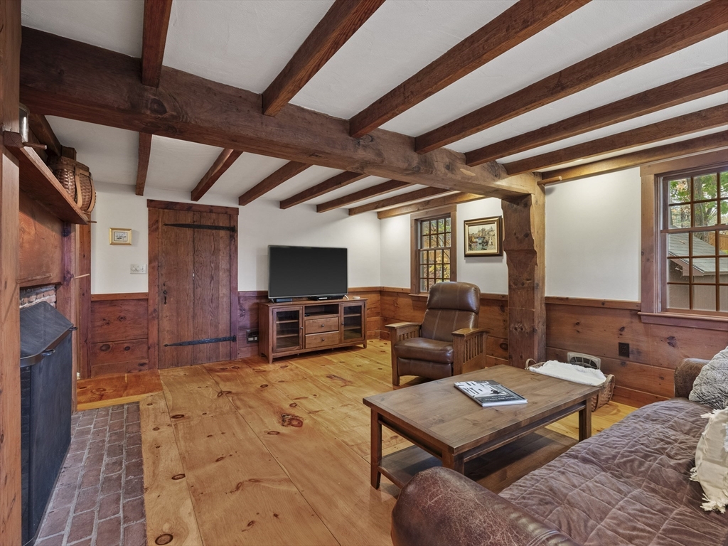 38 Mohawk Drive Acton, MA 01720 - Photo 7 of 35 a living room with furniture and a flat screen tv