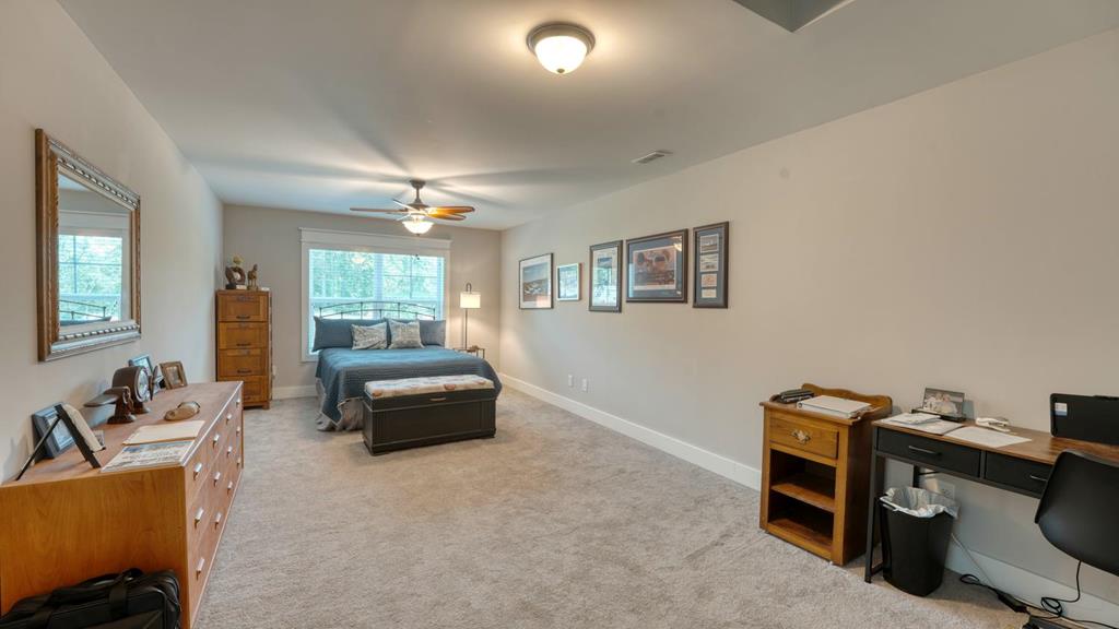 31 Elf School Road Hayesville, NC 28904 - Photo 47 of 59 a bedroom with furniture and a window