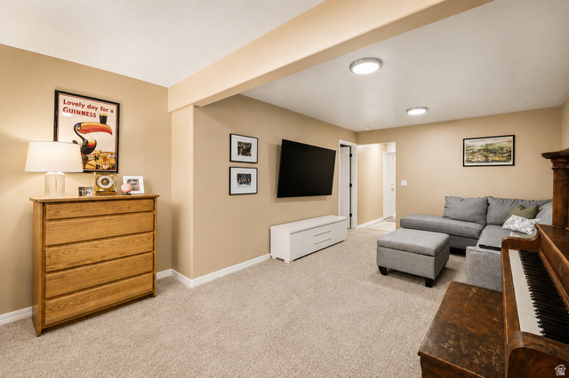 204 Lyman Lane Bountiful, UT 84010 - Photo 20 of 28 Carpeted room featuring a recessed ceiling beam and neutral wall tones
