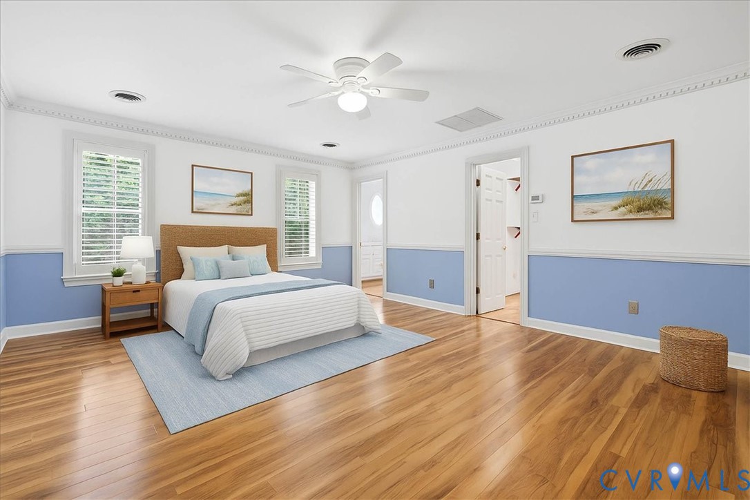 503 Prince George Avenue Hopewell, VA 23860 - Photo 14 of 25 a bedroom with a large bed and a chandelier