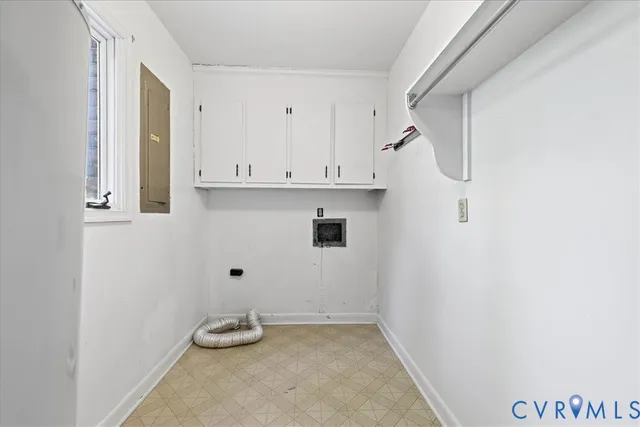 a view of table with white cabinet