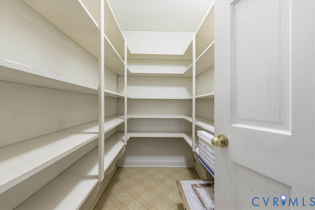 503 Prince George Avenue Hopewell, VA 23860 - Photo 10 of 25 a storage room with empty racks