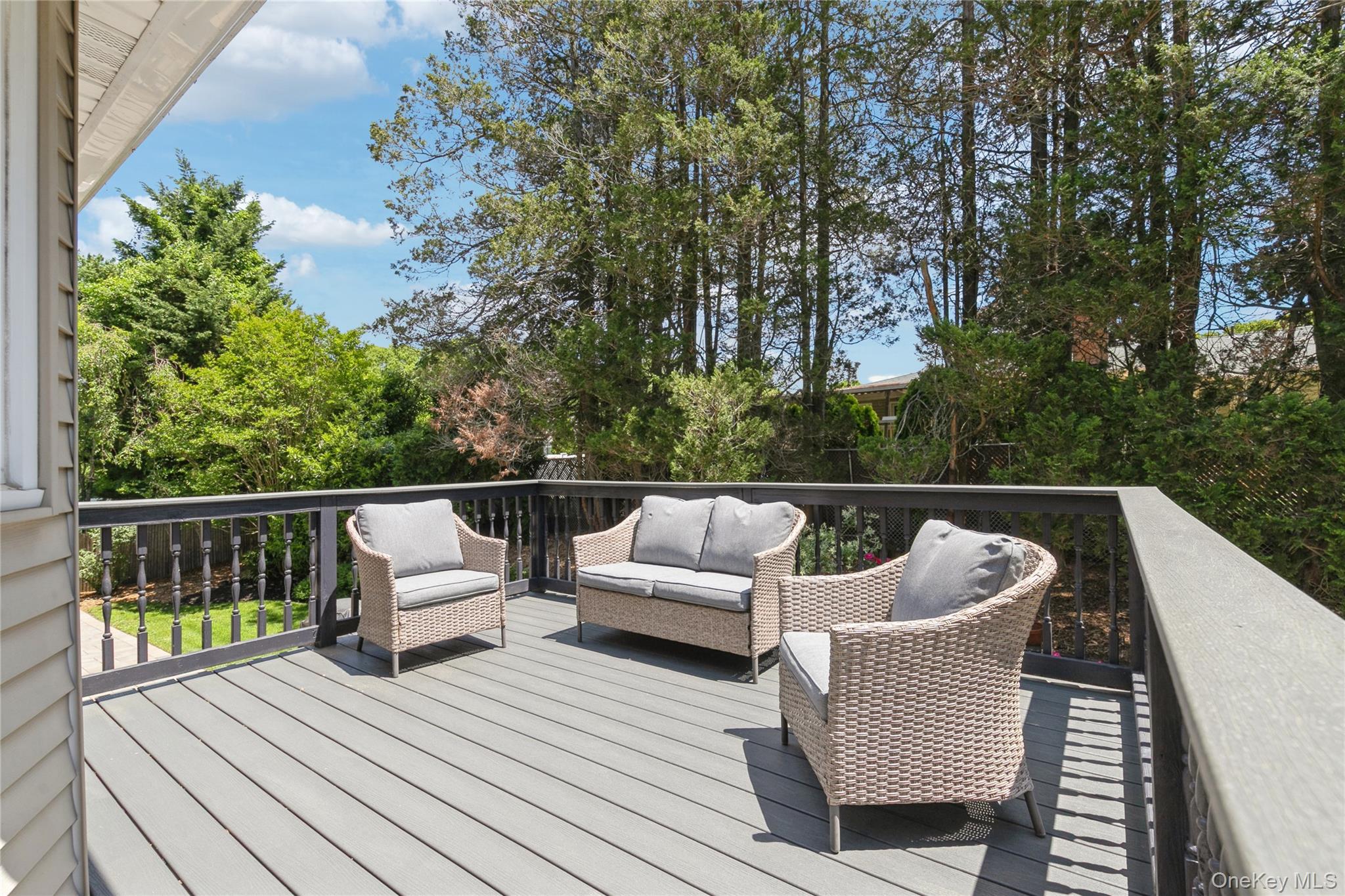115 Clarendon Road Ronkonkoma, NY 11779 - Photo 34 of 45 Expansive outdoor deck featuring composite decking and dark railings