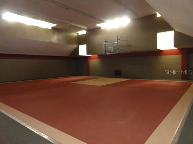 a bedroom with a bed and a night stand