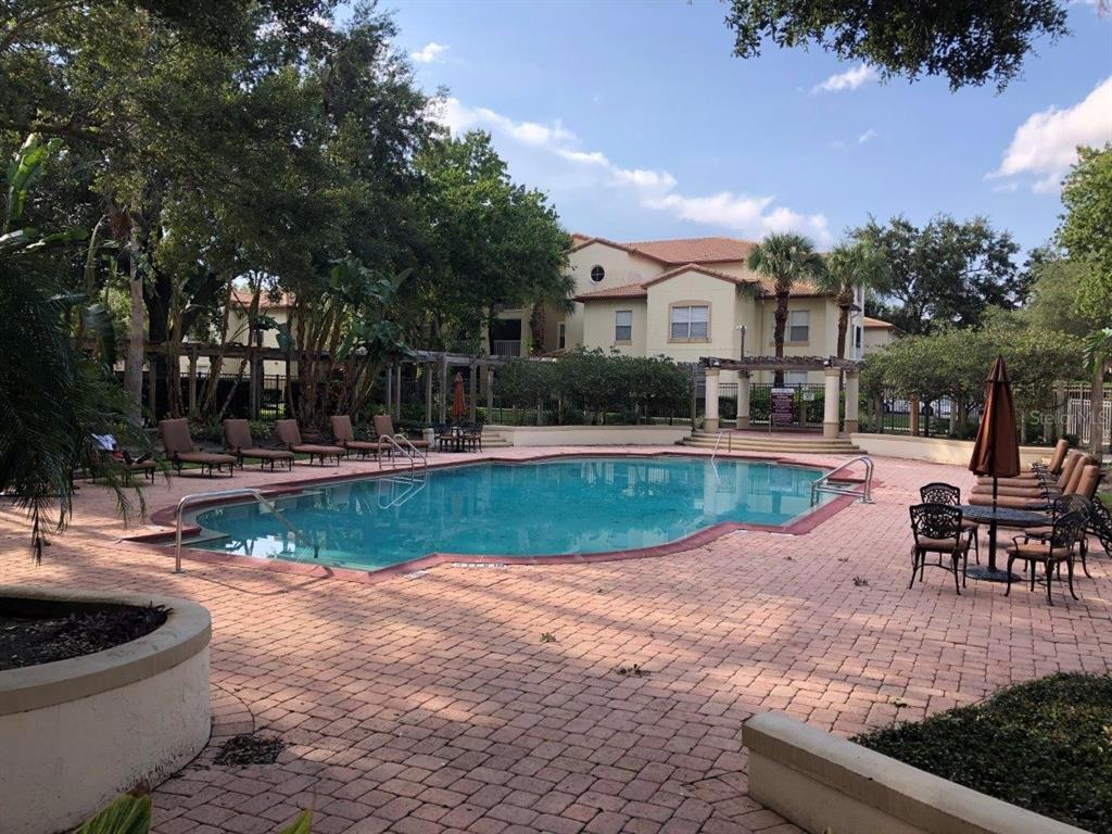 831 Camargo Way, Unit 302 Altamonte Springs, FL 32714 - Photo 2 of 28 a view of a house with swimming pool and sitting area