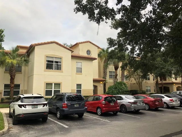 a view of a cars park in front of a house