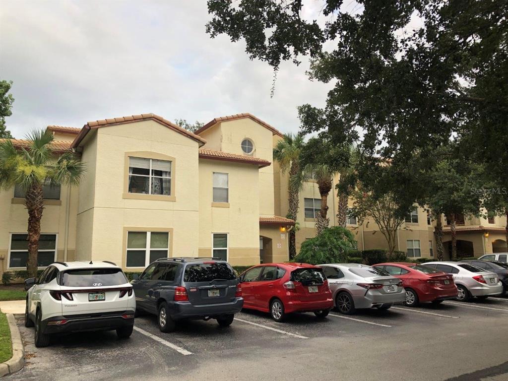 831 Camargo Way, Unit 302 Altamonte Springs, FL 32714 - Photo 24 of 28 a view of a cars park in front of a house