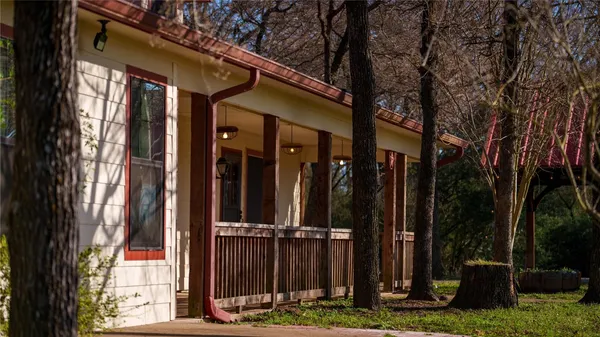 a view of porch with a big yard