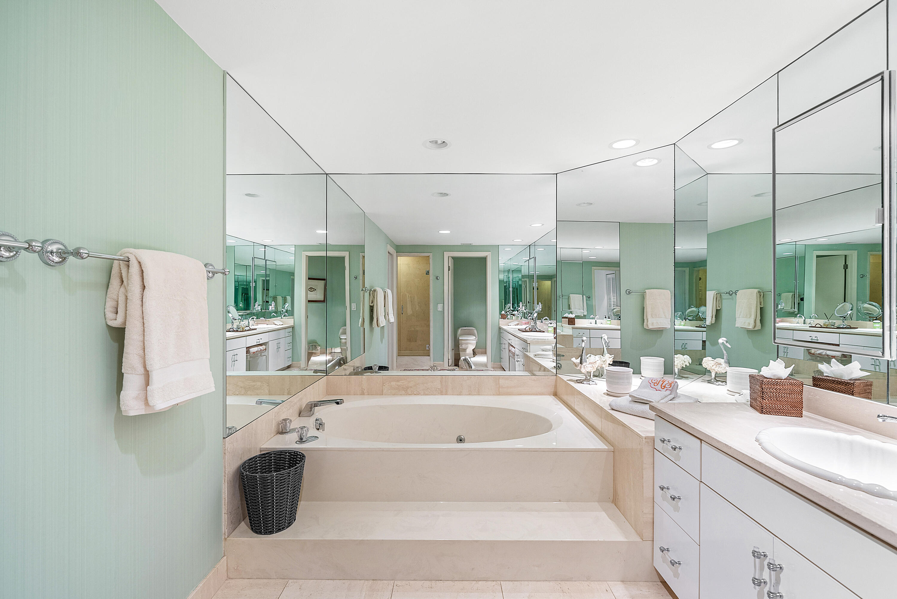 3140 South Ocean Boulevard, Unit 303S Palm Beach, FL 33480 - Photo 14 of 33 a large white tub sitting in a bathroom next to a large window