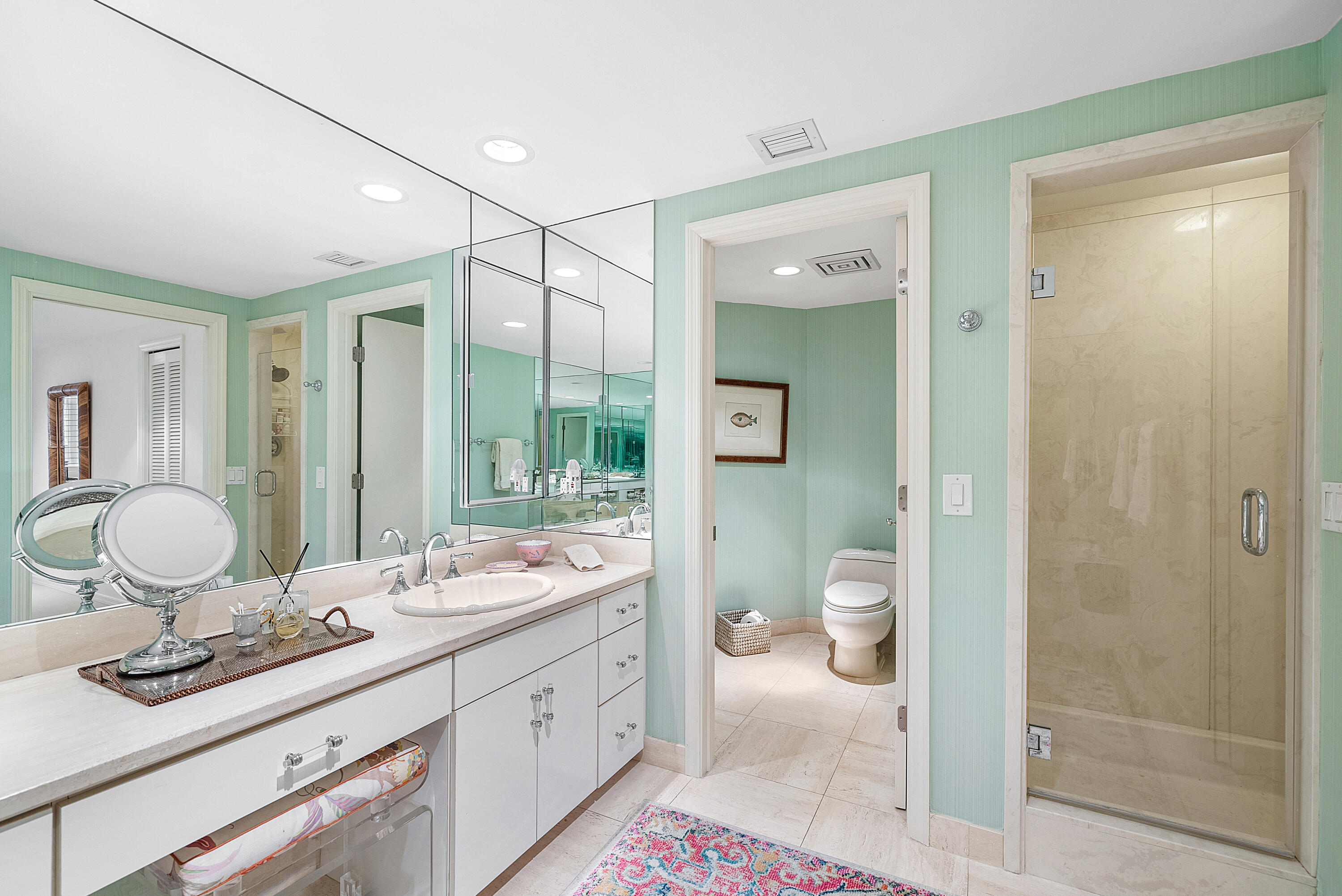 3140 South Ocean Boulevard, Unit 303S Palm Beach, FL 33480 - Photo 15 of 33 a bathroom with a granite countertop sink a toilet and a mirror