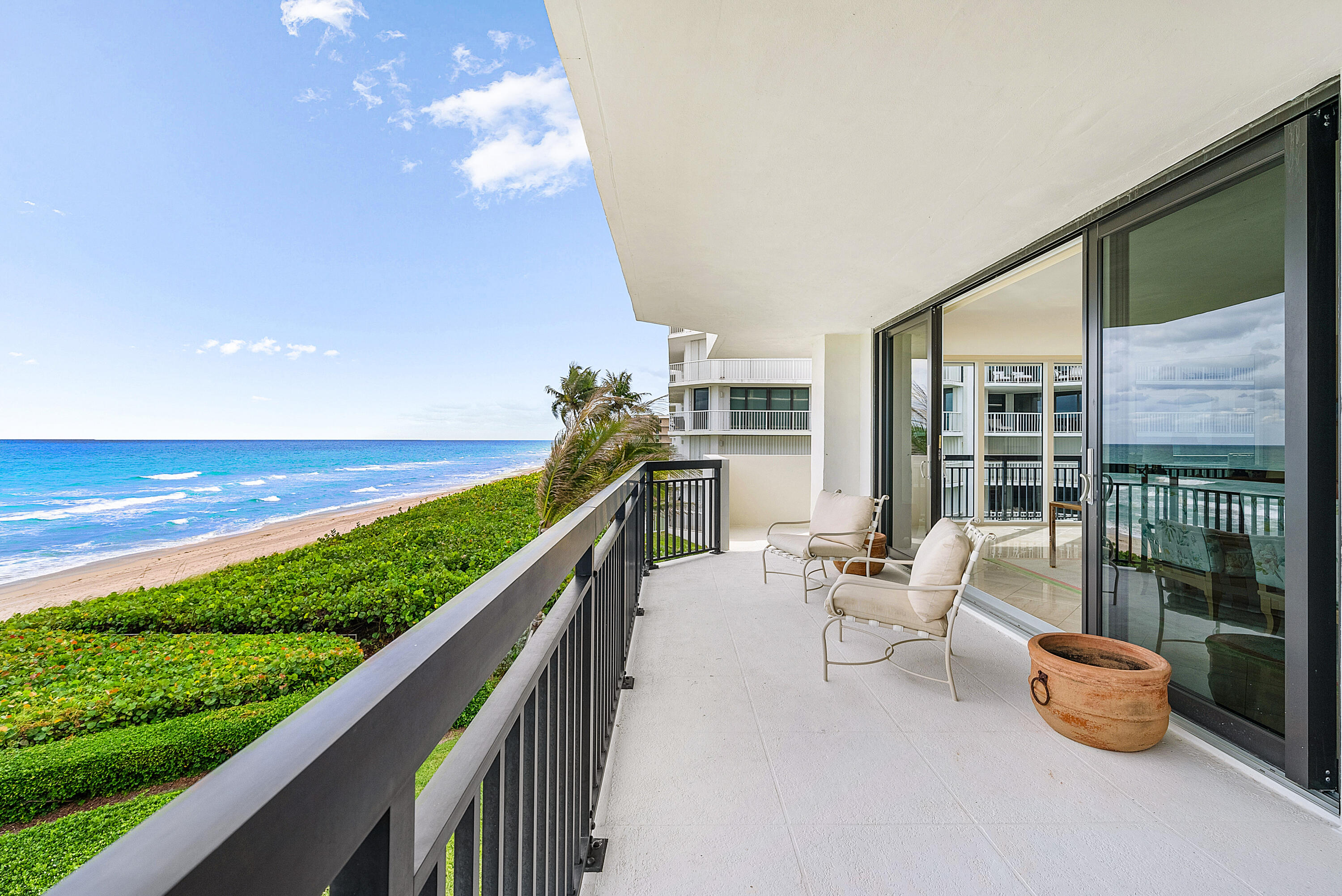 3140 South Ocean Boulevard, Unit 303S Palm Beach, FL 33480 - Photo 21 of 33 a balcony with chairs and ocean view