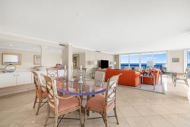 a view of a dining room with furniture and a livingroom