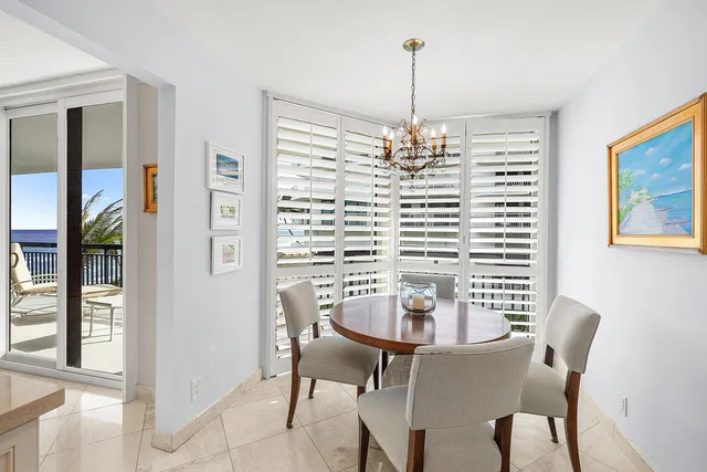 a view of a dining room with furniture and window