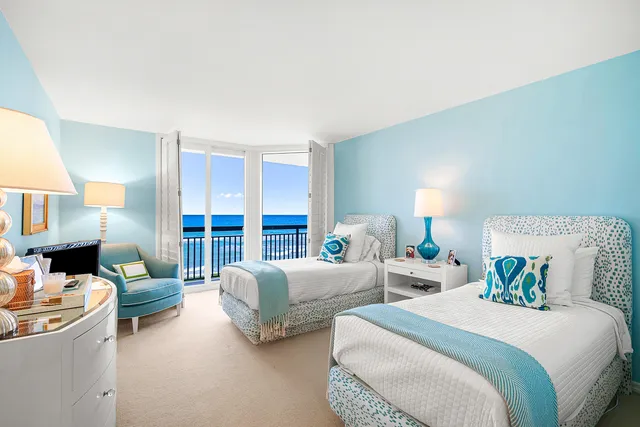 a bed room with two beds and a fireplace