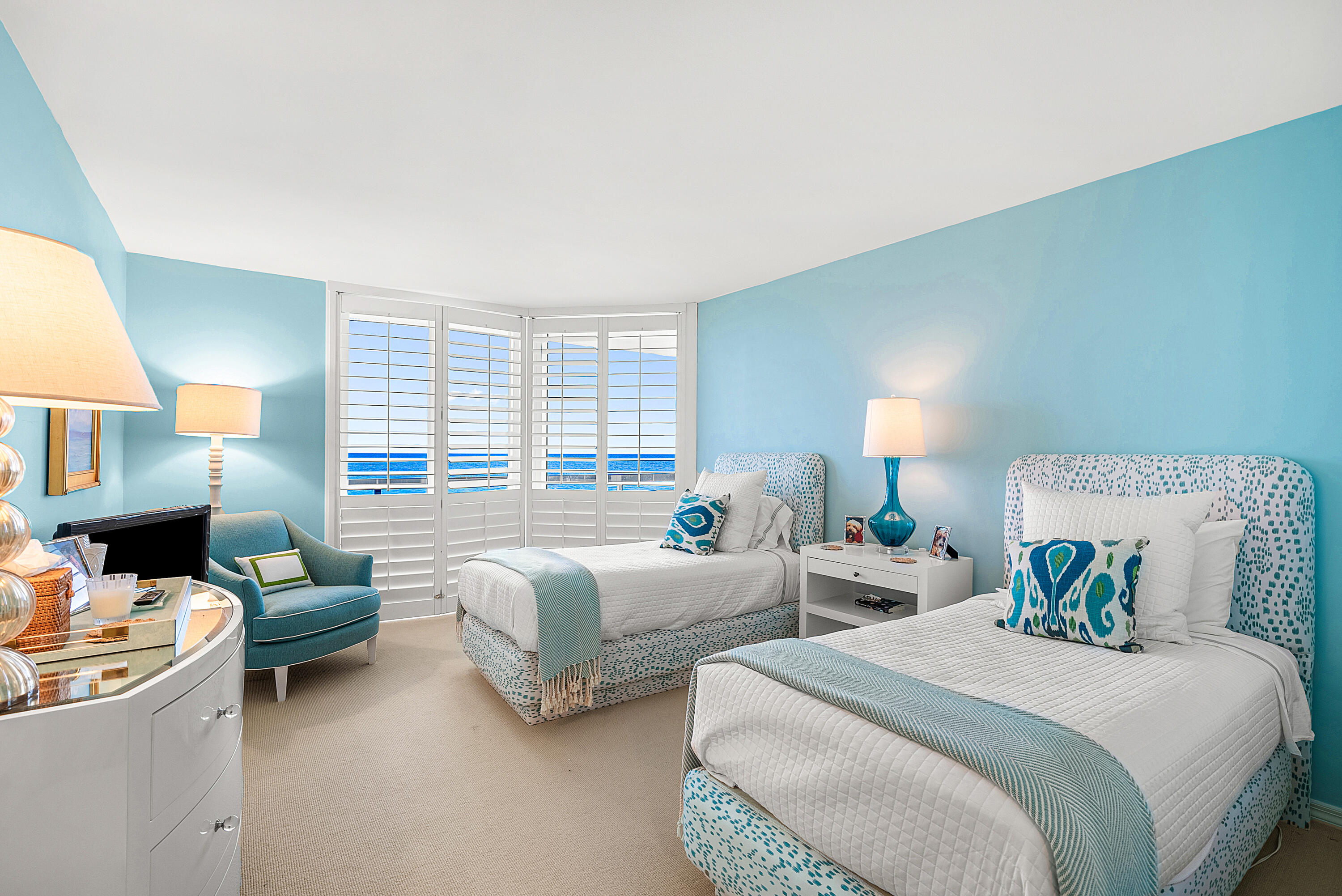 3140 South Ocean Boulevard, Unit 303S Palm Beach, FL 33480 - Photo 9 of 33 a bed room with two beds and a large window