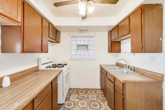 a bathroom with a sink a vanity and a mirror