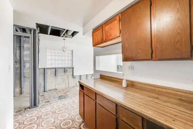 a kitchen with a sink and a window