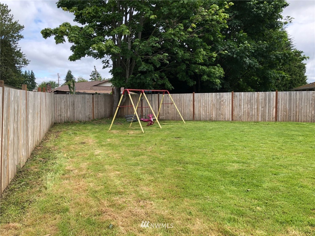11824 Alexander Road Everett, WA 98204 - Photo 3 of 14 a view of a backyard with a small cabin