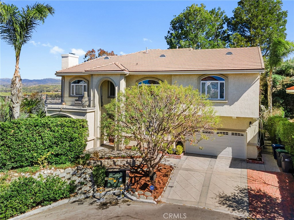 24806 Carlos Place Newhall, CA 91321 - Photo 1 of 56 a aerial view of a house with a yard and potted plants