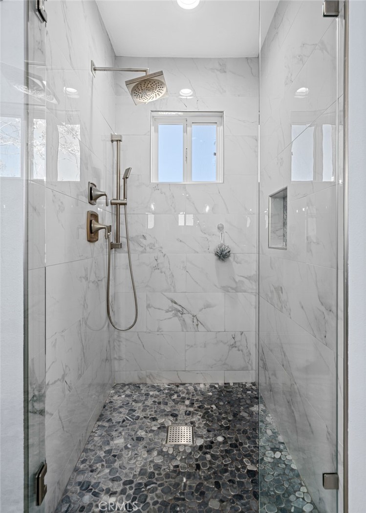 24806 Carlos Place Newhall, CA 91321 - Photo 25 of 56 a bathroom with a shower