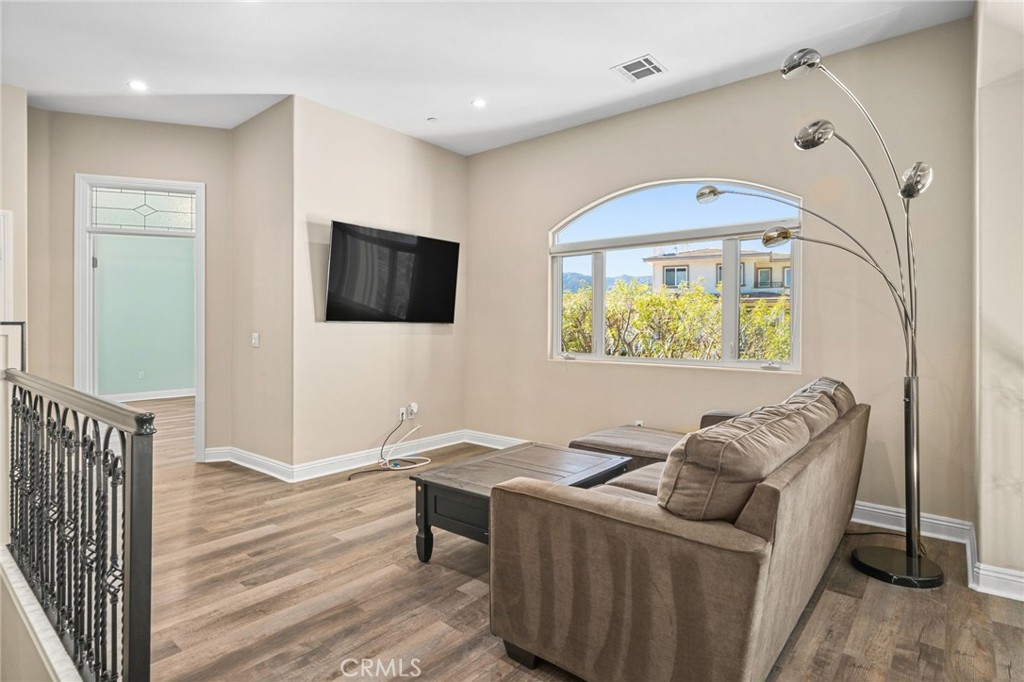 24806 Carlos Place Newhall, CA 91321 - Photo 28 of 56 a living room with furniture and a flat screen tv