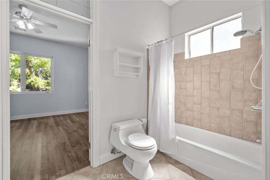 24806 Carlos Place Newhall, CA 91321 - Photo 32 of 56 a bathroom with a toilet and a bathtub