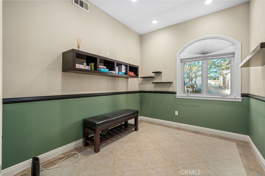24806 Carlos Place Newhall, CA 91321 - Photo 37 of 56 a room with cabinets and a window