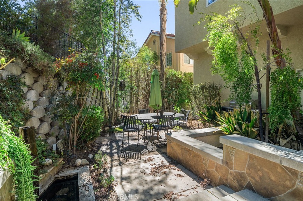 24806 Carlos Place Newhall, CA 91321 - Photo 42 of 56 a view of a chairs and table in a patio