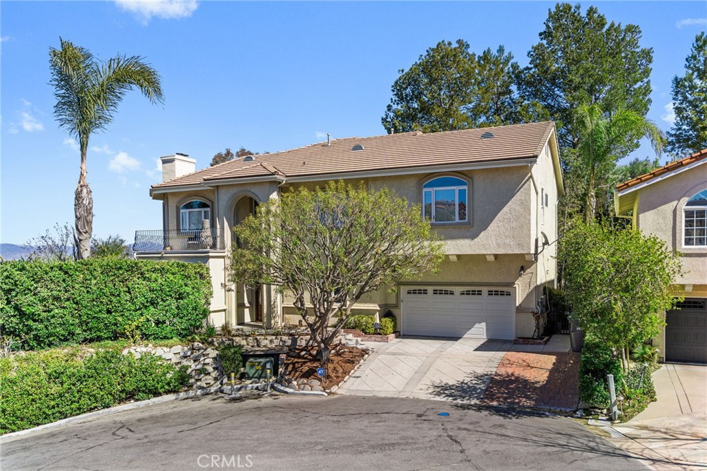 24806 Carlos Place Newhall, CA 91321 - Photo 48 of 56 a front view of a house with garden