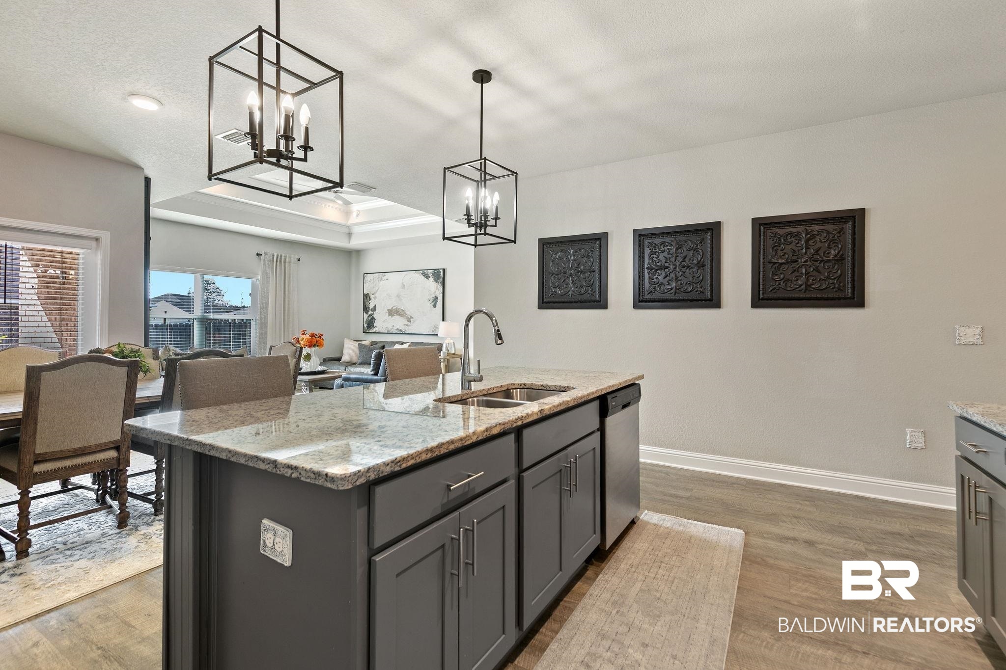 31650 Memphis Loop Daphne, AL 36527 - Photo 14 of 68 Kitchen with a center island with sink, light stone counters, gray cabinets, and a tray ceiling