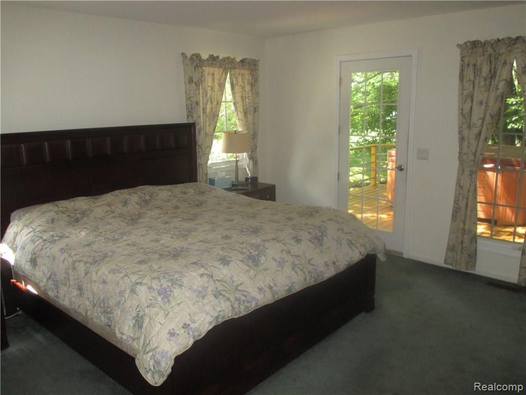11465 Bruce N Lane Romeo, MI 48065 - Photo 35 of 43 1st Floor Master with French Door to newer Deck and Hot Tub!